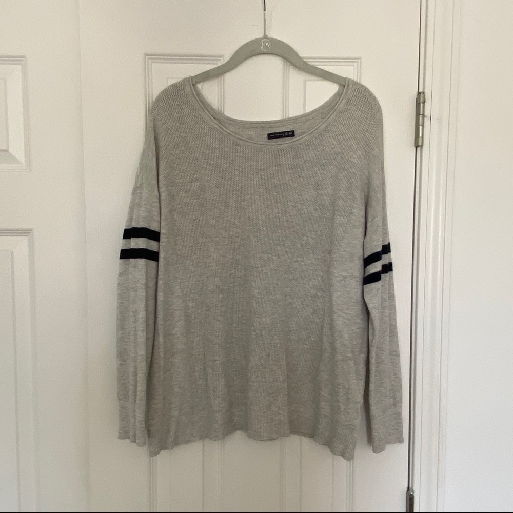Grey sweater with stripes on arms